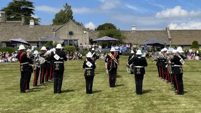 The Royal Marines Band Collingwood performing on the front Lawn of Dorothy House in Winsley near Bradford-on-Avon.