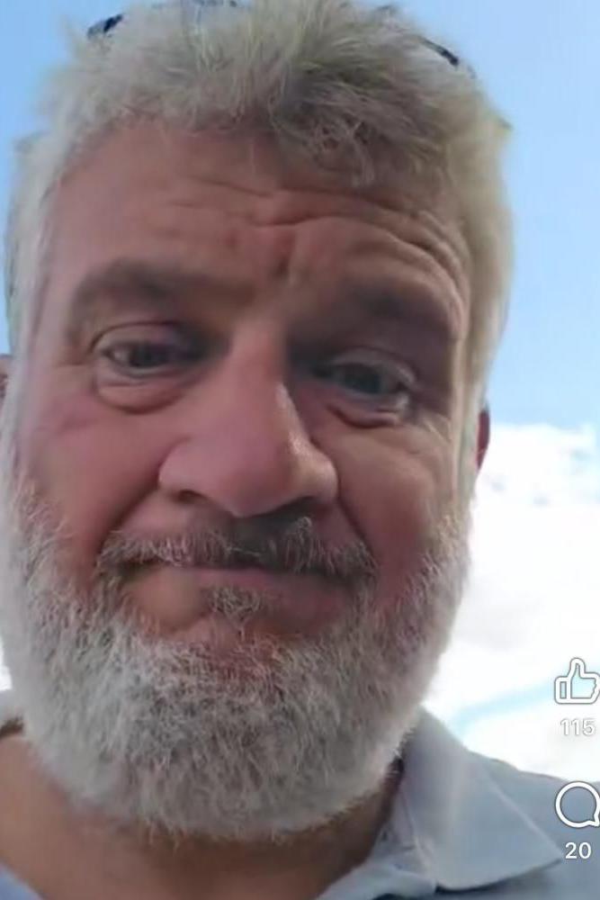 A selfie of Mr Farquharson, who has short grey hair and a grey beard. It is a screenshot of his social media video.