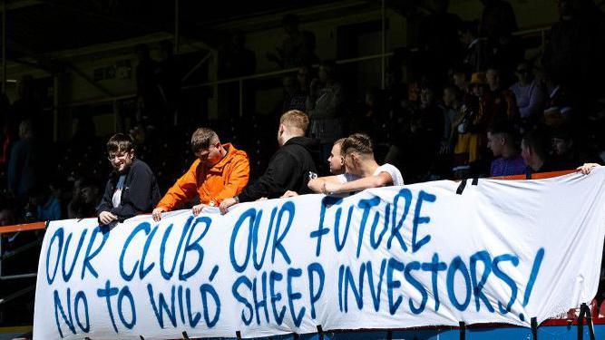 Motherwell fans display banner in protest to potential Wild Sheep investment