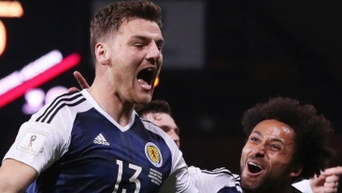 Scotland's Chris Martin and Ikechi Anya celebrate