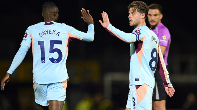 Brentford's Mathias Jensen celebrates scoring against Grimsby with team-mate Frank Onyeka