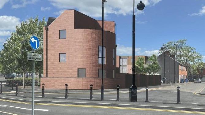 Artist's impression of the completed homes, which feature a rounded brick clad building next to a road junction