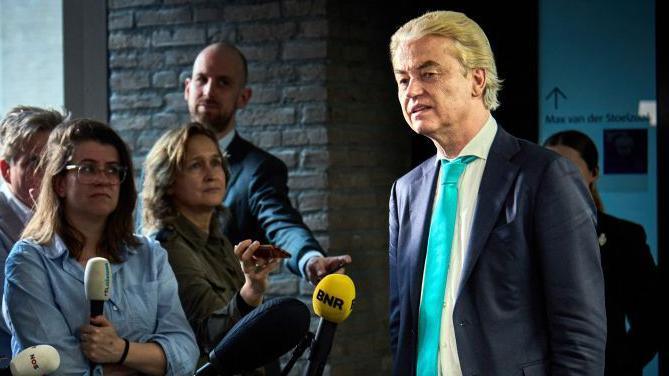 Dutch far-right PVV party leader Geert Wilders speaks to the press before the start of follow-up government formation talks in April 2024