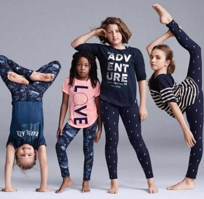 An advert showing a white girl resting her arm on a black girl's head