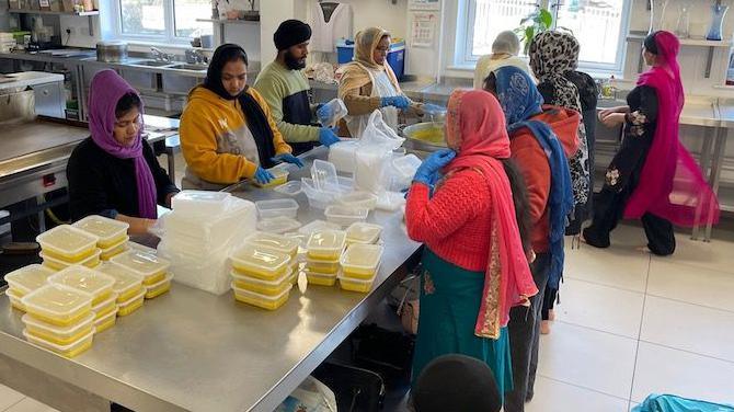 Volunteers at the Luton Guru Nanak Gurdwara prepare hot meals for the local community