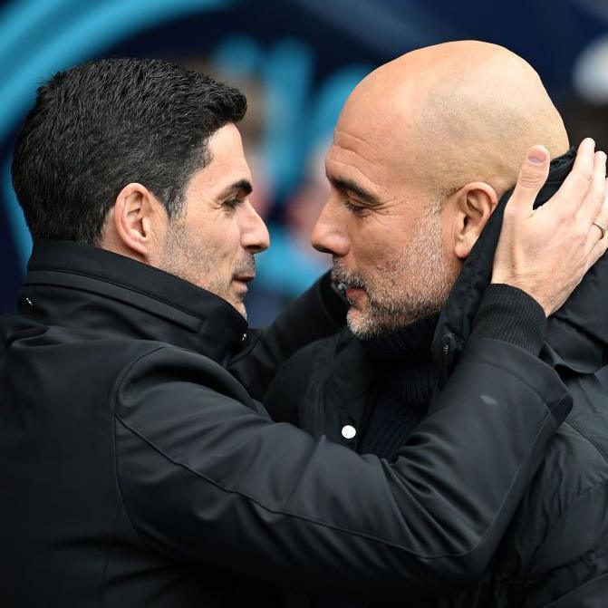 Arsenal manager Mikel Arteta embracing Manchester City boss Pep Guardiola