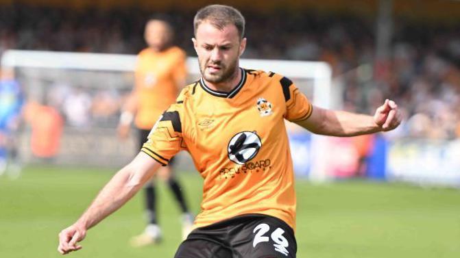 James Gibbons playing for Cambridge United