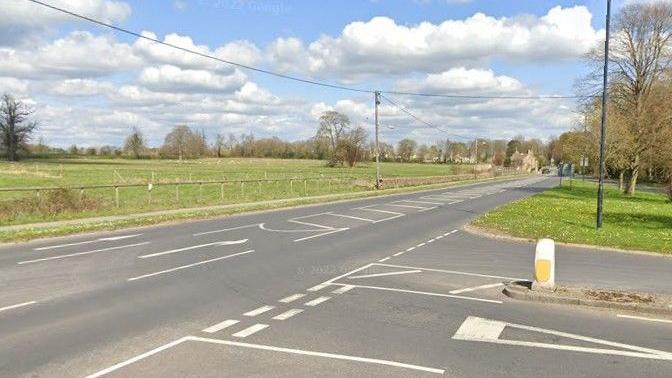 The junction of the B3109 and A4 at Corsham in Wiltshire. It is a clear sunny day and the road is empty