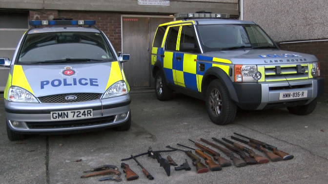 Police cars and rifles