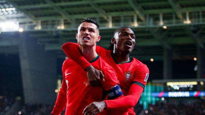 Cristiano Ronaldo celebrates his second goal against Poland