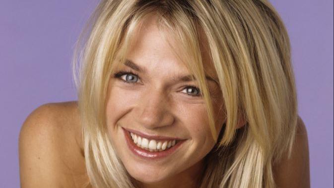 Zoe Ball in 1997, smiling in an orange top