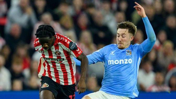 Coventry's Josh Eccles challenges Sunderland's Eliezer Mayenda in last season's Championship semi-final