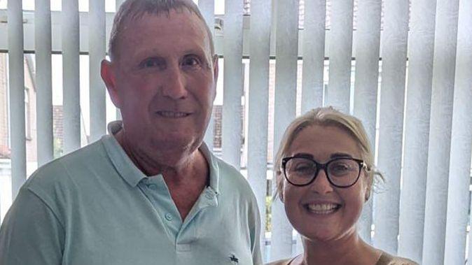 Kidney donor Stephen Topping and recipient Amy Smith. Stephen is wearing a teal polo shirt, Amy has blonde hair and glasses