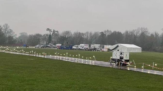 A marquee and temporary pathways can be seem on the flood plain next to the River Ver near Westminster Lodge together with some production vehicles.