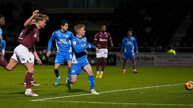 Cameron McGeehan strikes the winning goal for Northampton against Peterborough 