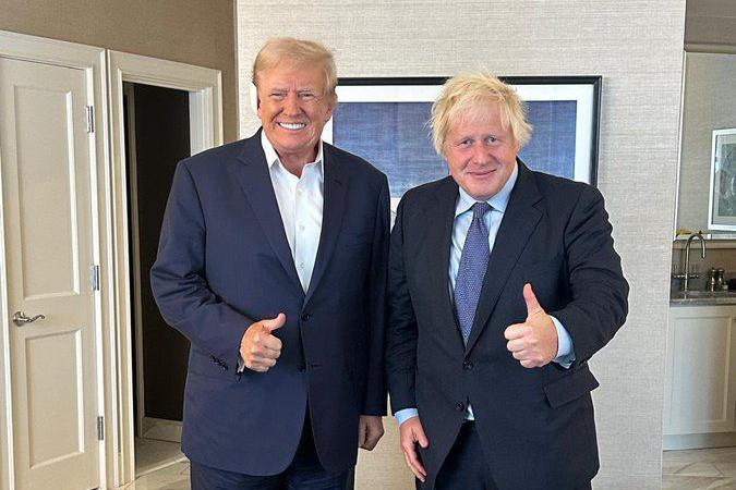 Boris Johnson poses for a photograph with Donald Trump 