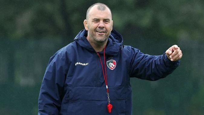 Michael Cheika points his arm while running a training session with Leicester