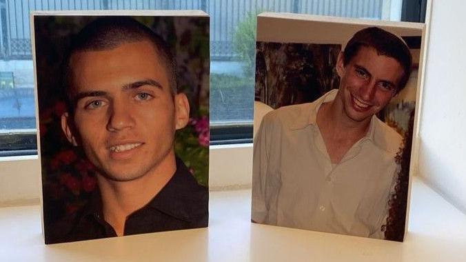 Photos of Israeli soldiers Oron Shaul (left) and Hadar Goldin (right) on a windowsill in Israeli Prime Minister Benjamin Netanyahu's office