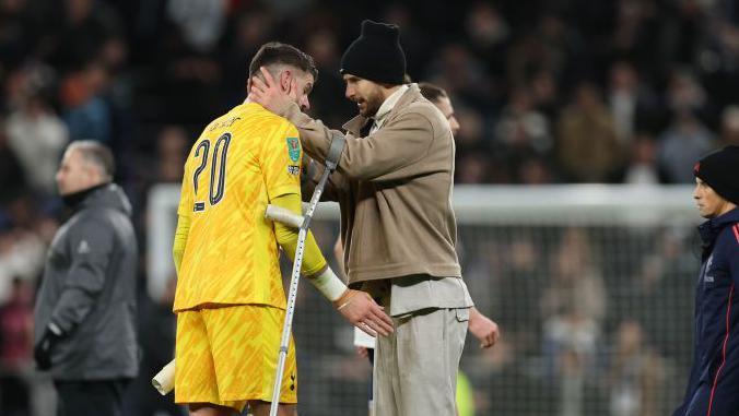 Fraser Forster and Guglielmo Vicario embrace after the game
