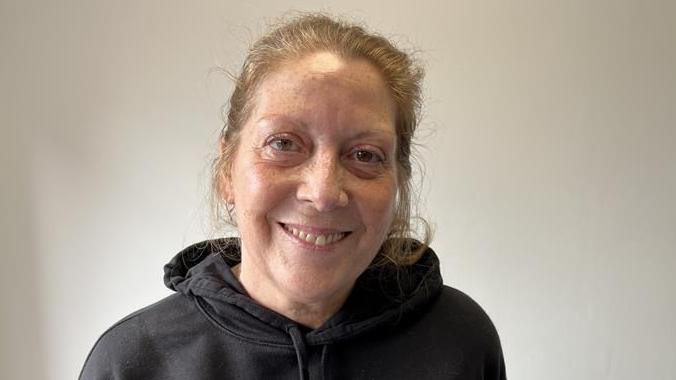 Kate Whoriskey smiles in the cafe at Cascades leisure centre, Gravesend