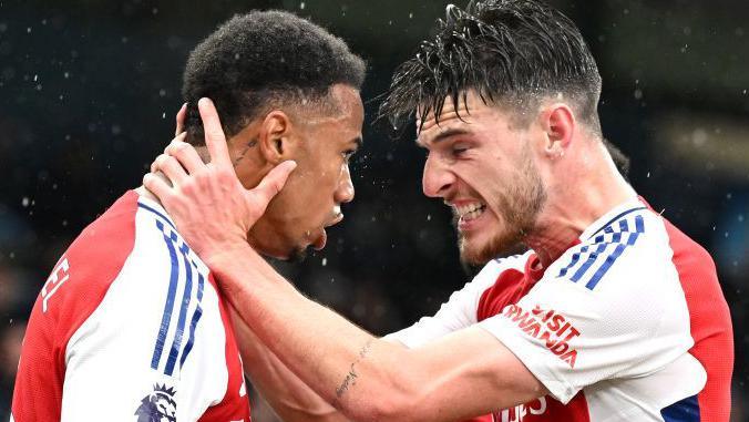 Arsenal's Declan Rice celebrates with Gabriel after the defender's goal against Manchester City at Etihad Stadium