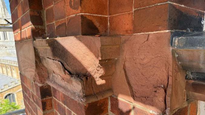 The chipped features of the brickwork
