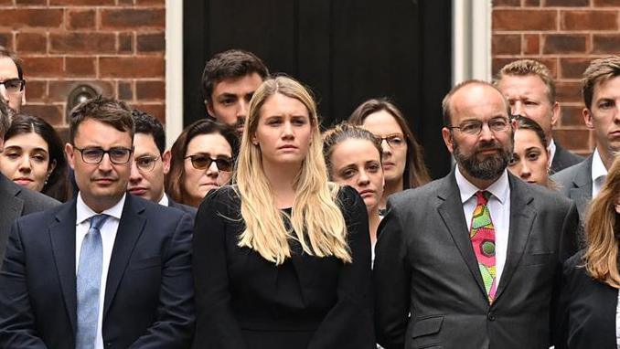 Charlotte Owen standing in Downing Street with allies of Boris Johnson as he announced his resignation