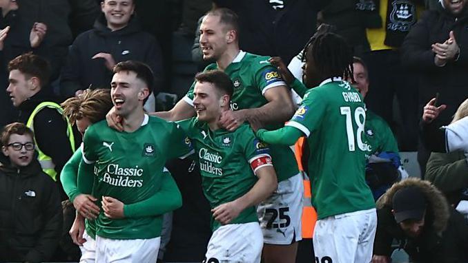 Plymouth players celebrate Ryan Hardie's penalty in the stunning FA Cup fourth win against Liverpool