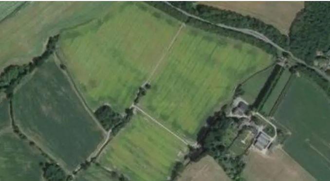 An aerial photograph shows the farmland the digester would be built on. 