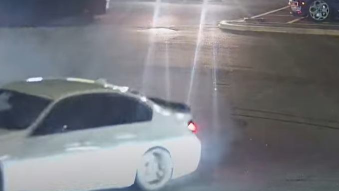 A white BMW doing donuts in a car park in Nottinghamshire