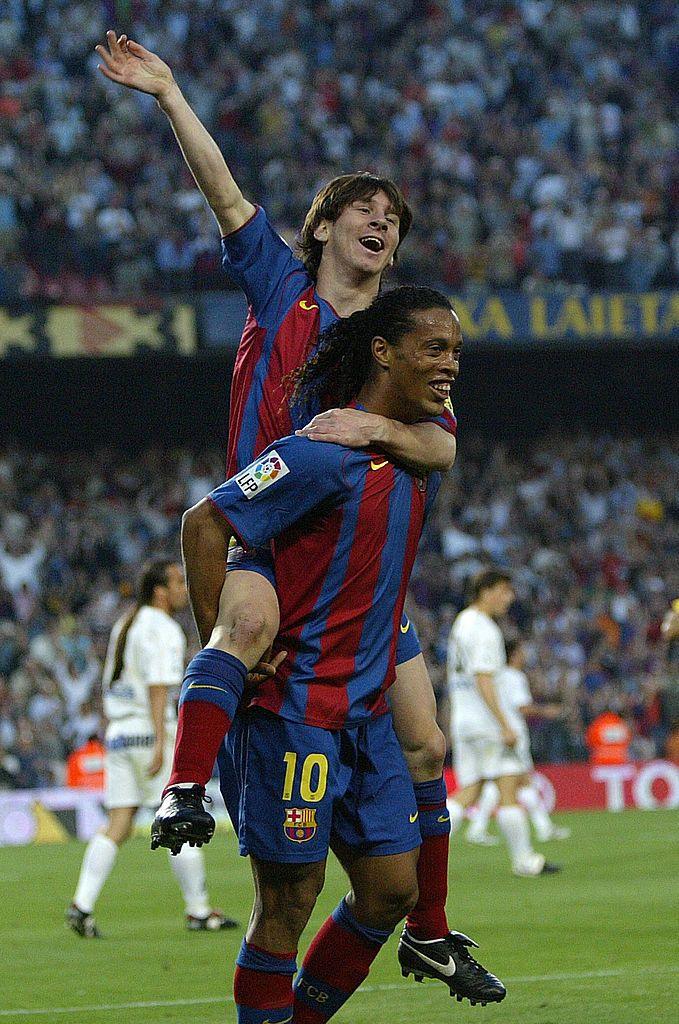 Barcelona's Messi and Brazilian Ronaldinho celebrate.
