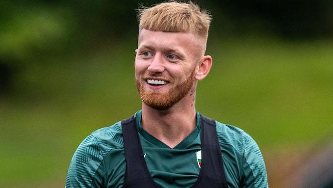 Brad Young smiles in training