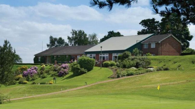 The former Staffordshire Golf Club house made from red brick and green cladding