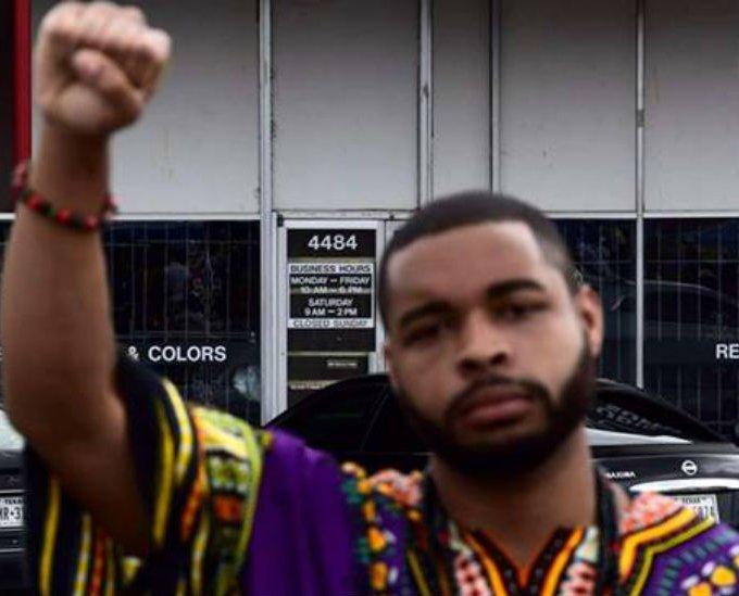 Images from the Facebook page of Micah Johnson showing him giving a 'black power' salute