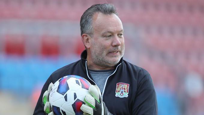 Kevin Shoemake wearing a Northampton kit during his time as goalkeeper coach.