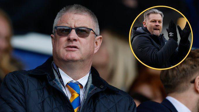 Micky Moore sat in stand looking out to pitch