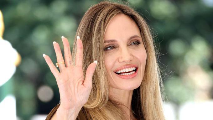 Angelina Jolie waving