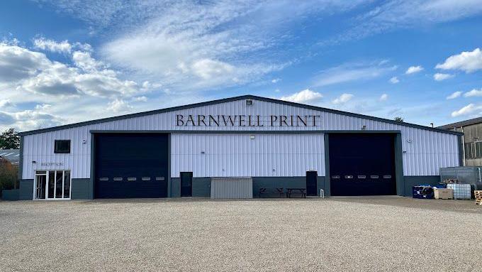 The front of the factory of Barnwell Print showing two large trade doors