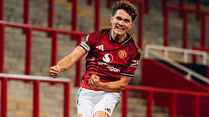 Manchester United's Jacob Devaney celebrates