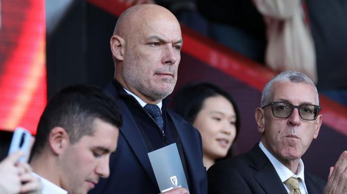 PGMOL chief Howard Webb watching a football match from the stands