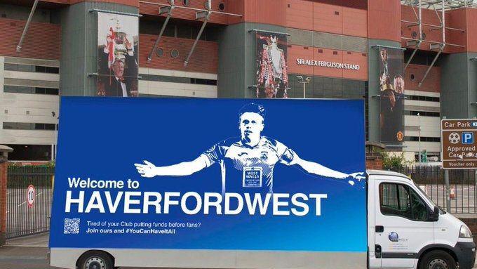 The Welcome to Haverfordwest advert featuring Jack Wilson outside OId Trafford in Manchester in 2022