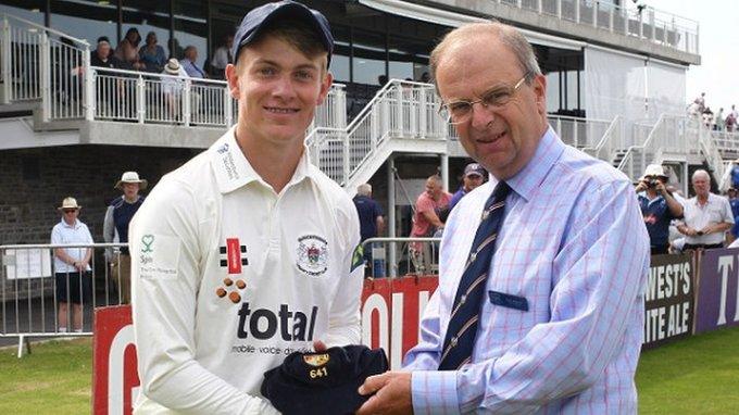 Patrick Grieshaber receives his cap from honorary treasurer Tony Elgood