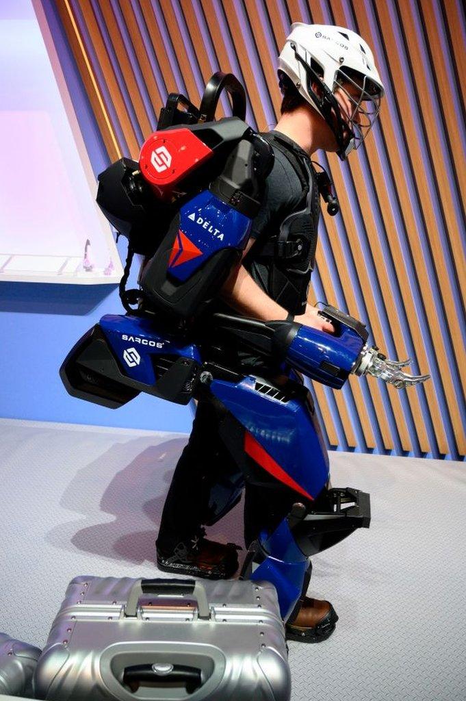 A man trying out Sarcos Robotics' exoskeleton