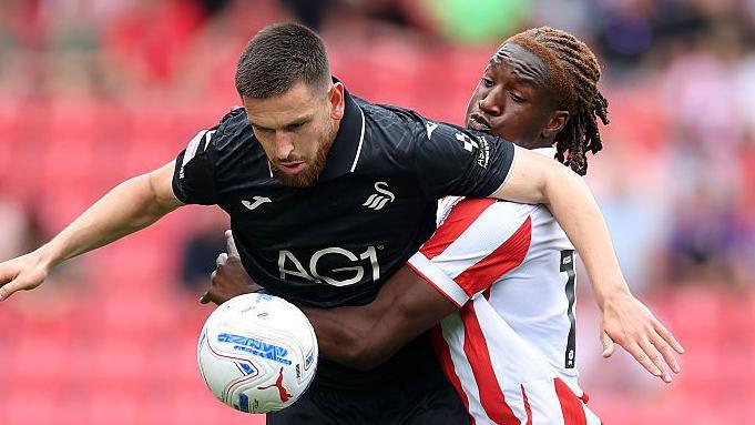 Zan Vipotnik holds up the ball against Stoke City in the Championship