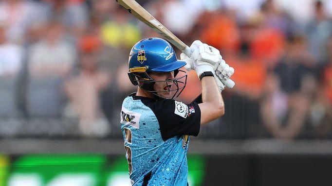Liam Scott swings his bat during a match for Adelaide Strikers