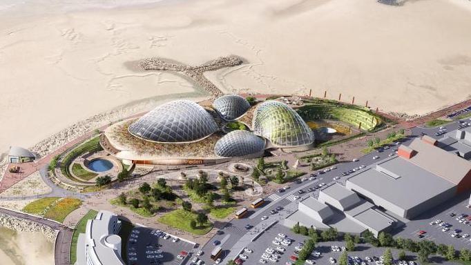 An artist's impression of a beach from above showing four large glass domes surrounded by greenery and gardens are on the beach. 