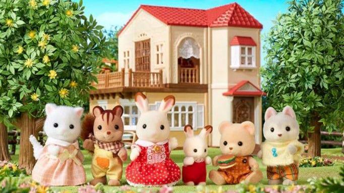 Sylvanian Families characters outside a house