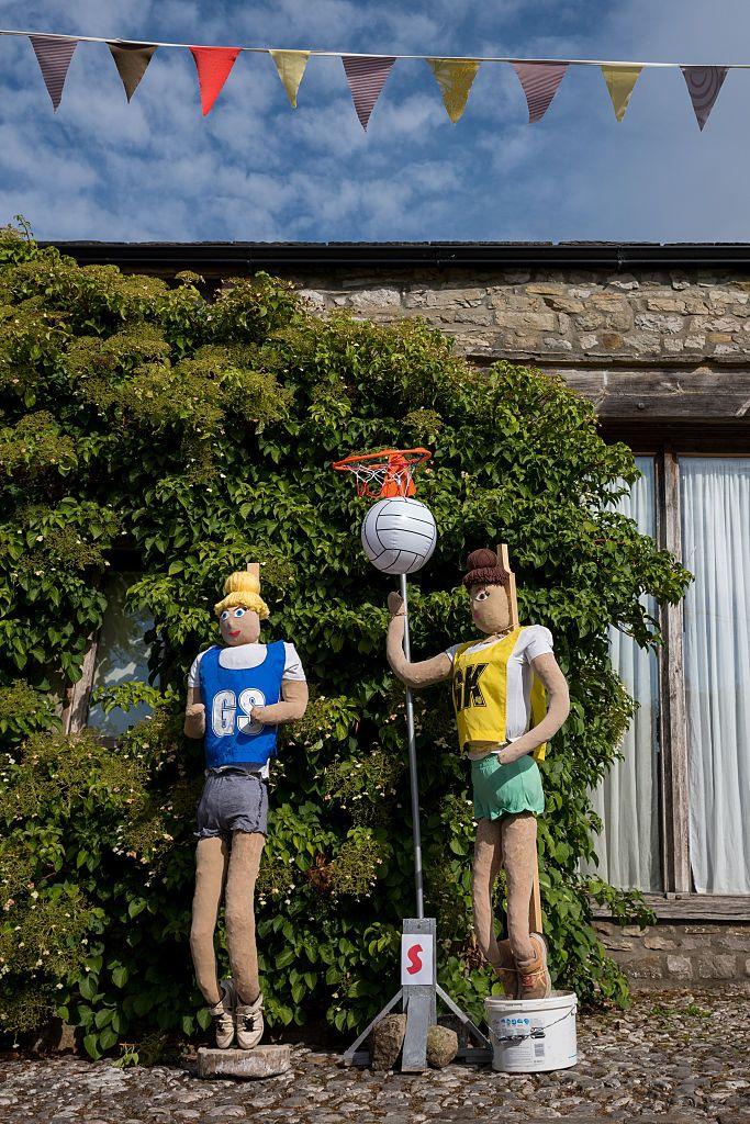 This display shows two scarecrows playing netball, while wearing GS and GK bibs.
