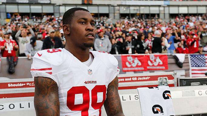 The San Francisco 49ers' Aldon Smith sits on the sidelines