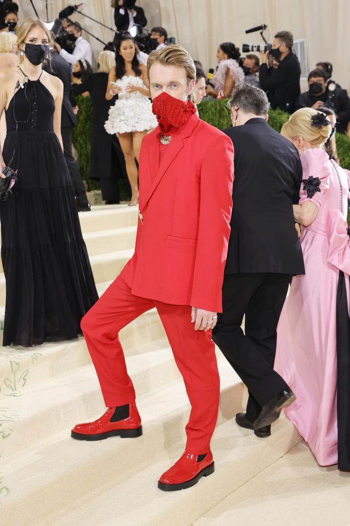 Finneas O'Connell in a red suit